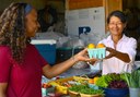 (R-L) Purple Skies Farm Owner Visar Duane shows NRCS District Conservationist Lynette Harmon heirloom tomatoes that she has grown on the farm. (NRCS photo by Brooke DeCubellis)